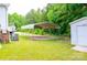 Carport next to storage shed, offering covered parking and additional storage solutions at 745 Rock Castle Dr, York, SC 29745