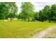 Spacious front yard with lush greenery, providing a welcoming entrance and a sense of openness at 745 Rock Castle Dr, York, SC 29745