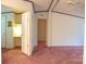 Hallway with red carpet, doorframe, and view of a built-in desk at 745 Rock Castle Dr, York, SC 29745