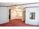 Living Room with carpet, door frame and ceiling fan, leading to a dining area and kitchen at 745 Rock Castle Dr, York, SC 29745
