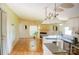 Open-concept living room with fireplace, breakfast bar, and hardwood floors offers a bright and inviting space at 745 Rock Castle Dr, York, SC 29745