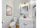 Cozy bathroom featuring a pedestal sink, toilet, and modern decor at 8709 Huntland Ct, Charlotte, NC 28277