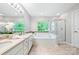 Elegant bathroom featuring double sinks, a separate shower, and a luxurious soaking tub at 8709 Huntland Ct, Charlotte, NC 28277