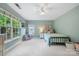 Blue bedroom with many windows for ample light at 8709 Huntland Ct, Charlotte, NC 28277