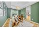 Inviting dining area featuring a wood table, bench seating, and a stylish rug at 8709 Huntland Ct, Charlotte, NC 28277