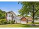 Beautiful two-story home featuring a brick and siding exterior, a spacious lawn, and a two-car garage at 8709 Huntland Ct, Charlotte, NC 28277
