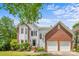 Charming two-story home with a well-manicured lawn, two car garage, and welcoming front entrance at 8709 Huntland Ct, Charlotte, NC 28277