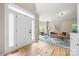 Inviting living room featuring hardwood floors, lots of natural light, and contemporary furniture at 8709 Huntland Ct, Charlotte, NC 28277