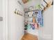 Organized pantry with shelving, hooks, and ample storage for groceries and household items at 8709 Huntland Ct, Charlotte, NC 28277