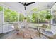 Screened-in porch with a ceiling fan for outdoor entertaining at 8709 Huntland Ct, Charlotte, NC 28277