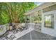 Outdoor screened porch with grill at 8709 Huntland Ct, Charlotte, NC 28277