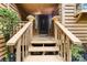 Inviting entryway with warm wood steps, flower pots, and a welcoming blue 'Home' doormat at 9013 St Croix Ln, Charlotte, NC 28277