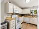 Charming kitchen with white cabinets, bright lighting, and functional appliances at 9013 St Croix Ln, Charlotte, NC 28277