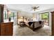 Warm and inviting main bedroom features a plush bed, large window, and private balcony at 9013 St Croix Ln, Charlotte, NC 28277