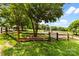 Community playground featuring a slide and climbing wall, all set in a well-maintained grassy area with mature trees at 9013 St Croix Ln, Charlotte, NC 28277