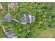 Aerial image shows mature trees surrounding the home with pool, a serene and private escape at 1001 Berwick Ct, Waxhaw, NC 28173