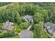 Aerial view of a home nestled among lush trees, showcasing its prime location and neighborhood at 1001 Berwick Ct, Waxhaw, NC 28173