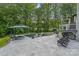 Resort-like backyard includes pristine pool, spa, patio with lounge chairs and an outdoor kitchen at 1001 Berwick Ct, Waxhaw, NC 28173