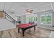 Finished basement with a pool table, exercise area, and natural light at 1001 Berwick Ct, Waxhaw, NC 28173