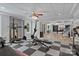 Spacious basement featuring a home gym and recreational area with stairs leading to other finished basement spaces at 1001 Berwick Ct, Waxhaw, NC 28173