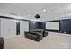 Media room in basement features a large screen and comfortable seating at 1001 Berwick Ct, Waxhaw, NC 28173