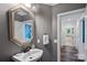 Cozy bathroom featuring an octagon mirror and modern fixtures at 1001 Berwick Ct, Waxhaw, NC 28173