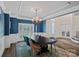 Formal dining room featuring elegant chandelier, wainscoting, and hardwood floors at 1001 Berwick Ct, Waxhaw, NC 28173