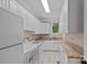 Laundry room featuring modern washer, dryer, and counter space at 1001 Berwick Ct, Waxhaw, NC 28173