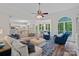 Open-concept living room featuring hardwood floors, neutral paint, a large arched window and an eat-in kitchen at 1001 Berwick Ct, Waxhaw, NC 28173
