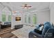 Open concept living room featuring natural light, tray ceiling, and stylish furnishing at 1001 Berwick Ct, Waxhaw, NC 28173