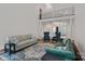 Open-concept living room with high ceilings, stylish furnishings, and abundant natural light with hardwood floors at 1001 Berwick Ct, Waxhaw, NC 28173