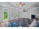 Spacious main bedroom with tray ceilings, neutral paint, hardwood floors and an abundance of natural light at 1001 Berwick Ct, Waxhaw, NC 28173