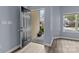 An inviting entryway with hard surface floors and a view of the exterior through the open door at 112 St Vincent Pl, Mount Holly, NC 28120