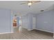 Open-concept living room leading to the kitchen, featuring hard surface floors and neutral paint at 112 St Vincent Pl, Mount Holly, NC 28120