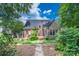 Beautiful backyard offers a private retreat with mature trees and lush landscaping at 11724 Brambleton Ct, Charlotte, NC 28277