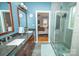Bathroom featuring double sinks, granite countertops, and seamless glass shower at 11724 Brambleton Ct, Charlotte, NC 28277