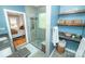 This bathroom features granite counters, built in shelves, and a glass shower at 11724 Brambleton Ct, Charlotte, NC 28277