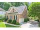 Brick home with a side-entry garage, black shutters, and a well-manicured lawn, offering great curb appeal at 11724 Brambleton Ct, Charlotte, NC 28277