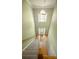 Grand foyer featuring a high ceiling with statement lighting, a staircase and hardwood floors at 11724 Brambleton Ct, Charlotte, NC 28277