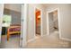 Hallway with bedrooms and bathrooms nearby, showcasing the home's layout at 11724 Brambleton Ct, Charlotte, NC 28277