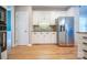 Bright kitchen with white cabinets, stainless steel appliances, and hardwood floors for a modern feel at 11724 Brambleton Ct, Charlotte, NC 28277