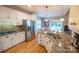Modern kitchen with stainless steel appliances, granite countertops and wooden floors by the dining area at 11724 Brambleton Ct, Charlotte, NC 28277