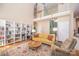 Bright and open living room with a vaulted ceiling, fireplace, built-in bookshelves, and hardwood floors at 11724 Brambleton Ct, Charlotte, NC 28277