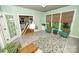 Bright sunroom with lots of natural light, neutral color scheme, and tile flooring at 11724 Brambleton Ct, Charlotte, NC 28277