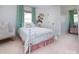 Charming bedroom featuring a white metal bed frame and soft, playful decor at 1208 Chausley Ct, Charlotte, NC 28211