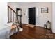 Inviting entryway with hardwood floors, staircase, and stylish decor at 1208 Chausley Ct, Charlotte, NC 28211