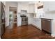 Bright kitchen featuring white cabinets, stainless steel appliances, and hardwood floors at 1208 Chausley Ct, Charlotte, NC 28211
