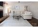 Cozy living room features a fireplace, plush seating, and neutral tones at 1208 Chausley Ct, Charlotte, NC 28211