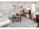 Open-concept living room with hardwood floors seamlessly flowing into a modern kitchen at 1208 Chausley Ct, Charlotte, NC 28211