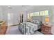 Light-filled bedroom with an open closet, multiple windows, and hardwood floors at 1241 Rollins Ave, Charlotte, NC 28205